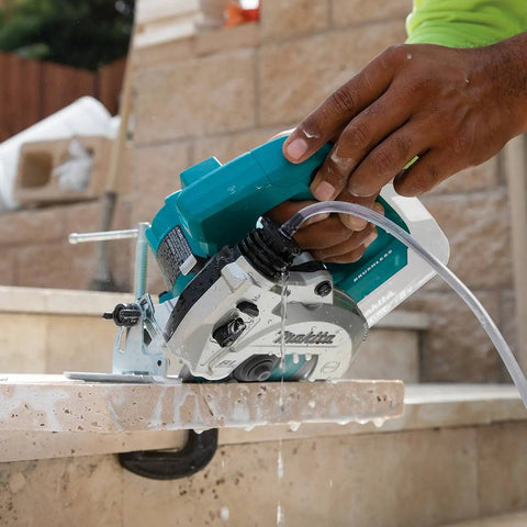 18V Cordless Wet and Dry Masonry Saw With Beefed-Up Brushless Motor, AWS Capable, 5-Inch Cutting in action on stone.