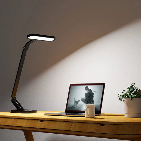 LED Desk Lamp With Eye Caring Light 72 LEDs 9 Brightness Levels 5 Color Modes USB Charging on wooden desk in home office