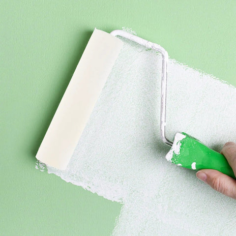 Premium High Density Polyurethane Sponge Paint Rollers 10 Pack with smooth white layer against green wall.