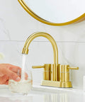 Gold Finish Bathroom Faucet With Dual Handles 360 Degree Rotating Stainless Steel Vanity Lavatory Sink Mixer Lead Free Modern Design Double Handle Commercial Style For Bathroom Sink Easy Operation And Clean Look with water flowing into a glass