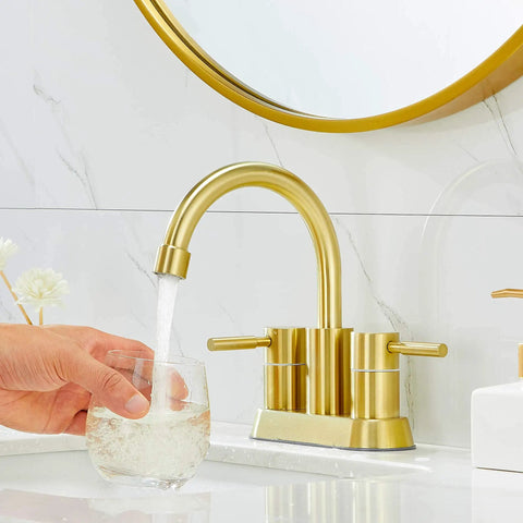 Gold Finish Bathroom Faucet With Dual Handles 360 Degree Rotating Stainless Steel Vanity Lavatory Sink Mixer Lead Free Modern Design Double Handle Commercial Style For Bathroom Sink Easy Operation And Clean Look with water flowing into a glass
