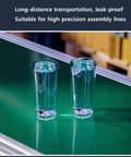 Compact LED Conveyor Belt For Factory Cargo 170X300mm with two glasses of water on a green surface for food processing.