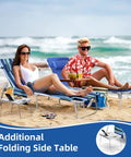 Couple relaxing on 3-In-1 Beach Chair with Face Holes and Folding Side Table, striped blue, at beach with ocean view, drinks on table.