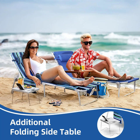 Couple relaxing on 3-In-1 Beach Chair with Face Holes and Folding Side Table, striped blue, at beach with ocean view, drinks on table.
