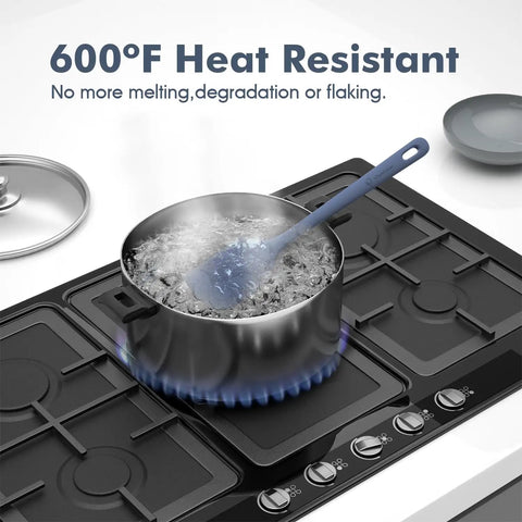Top Shelf Silicone Spatula Set Five Piece Kit Heat Resistant Up To Six Hundred Degrees Seamless Handle stirring a boiling pot.