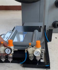 Pro Grade Tire Changer Air Compressor Regulator Kit installed on machine base, showing pressure gauge and quick connectors