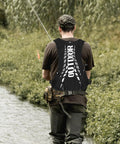 Rear view of person fishing wearing Go To Hydration Backpack For Running Cycling And Hiking With Quick Access Water Bladder.
