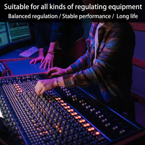 People using a mixing console in a recording studio, showcasing audio regulation with WH148 100K Potentiometers 6 Pin Dual Rotary Linear