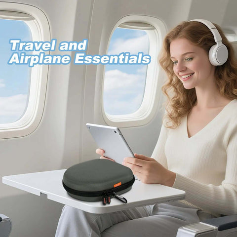 Heavy Duty Hard Shell Headphone Case, Tight Universal Travel Pouch With Rugged Quick Release Clip For On Ear And Over Ear Headphones on airplane tray table.