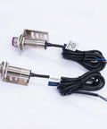 Indoor Wall Mounted Photoelectric Beam Sensor Pair, 0 To 20m Range, metal housing, 3-wire cables, close-up view.