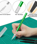 Miluosong 25-piece precision tool set with a green-handled craft knife and replaceable blade on a cutting mat