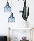 Blue Glass Pendant Lights For Kitchen Island In Modern Farmhouse Style Ceiling Hanging Fixtures above a shelf with cactus