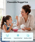 Mother and daughter enjoying chewy nugget ice from bowls, showcasing Quick Freeze Countertop Nugget Ice Maker Delivers 44 Pounds Of Soft Sonic Pellet Ice Daily With No Hassle Auto Wash And Smooth Chilling Performance For Everyday Households And Office Crews.