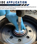 10-Piece Universal Aluminum Bearing Race and Seal Driver Set in use, showing knurled handle and non-marring discs installing wheel bearing.