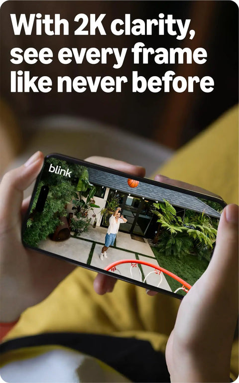 Person using a smartphone to view outdoor footage from a Level Up Your Home Security Game With This Black Outdoor Wireless Camera.