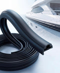 50 Ft Semi Rigid Boat Rub Rail Kit Marine Grade Dock Bumpers Flexible Rubber Dock Fender Rub Rail For Boat Hull Protection And Impact Absorption Black coiled near a yacht.