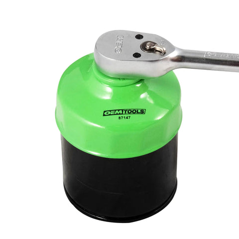 76 Millimeter 14 Flute Oil Filter Wrench for Easy Oil Changes Reinforced Three Eighths Inch Drive in use with a ratchet handle