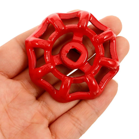 Person holding Red Shutoff Valve Handwheel Replacement Handles For Gate Valves Half Inch Metal Faucet Wheel Handle Kit For Outdoor Spigot Repair