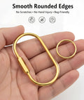 Close-up of a hand holding a gold carabiner and O-ring, showcasing Six Pack Gold Carabiner Key Ring Clips With Brass Screw Lock For Backpacks.