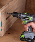 Side view of a WORKPRO cordless drill fitted with a countersink bit drilling into wood.
