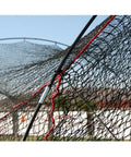 Close-up of nylon netting and frame of Xtender 48Ft Home Batting Cage With Foam Padding, Heavy Duty Nylon Netting, Steel Ground Stakes