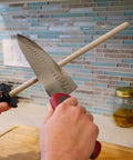 CS2 Ceramic Knife Sharpener And Honing Rod 12 Inch for Razor Sharp Edges in use on kitchen counter.