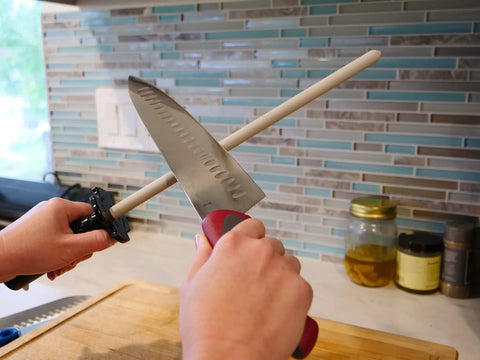 CS2 Ceramic Knife Sharpener And Honing Rod 12 Inch for Razor Sharp Edges in use on kitchen counter.