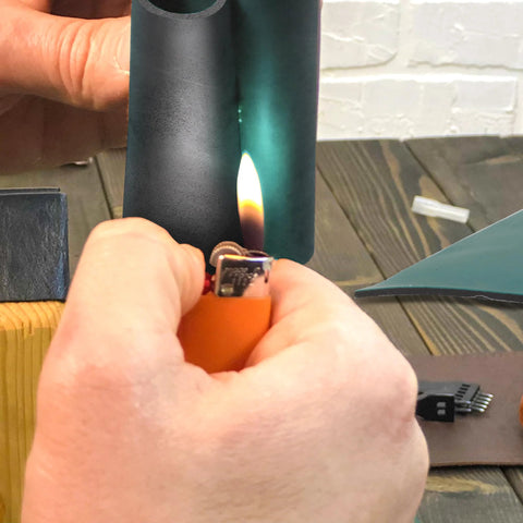 MYOYAY ESD rubber soldering mat large roll, anti-static ground protection, black, close-up with lighter flame