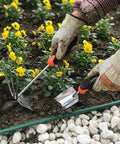 Using Heavy Duty Stainless Steel Garden Tool Set With Spade And Combination Hoe Fork Ergonomic Non Slip Handles For Digging Planting And Weeding Rust Resistant And Durable The Go To Workhorse For All Season Garden Tasks in flower bed