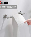 Hand placing towel on Sleek Dope Brushed Nickel 8-Piece Bathroom Hardware Set wall-mounted short stainless steel towel bar