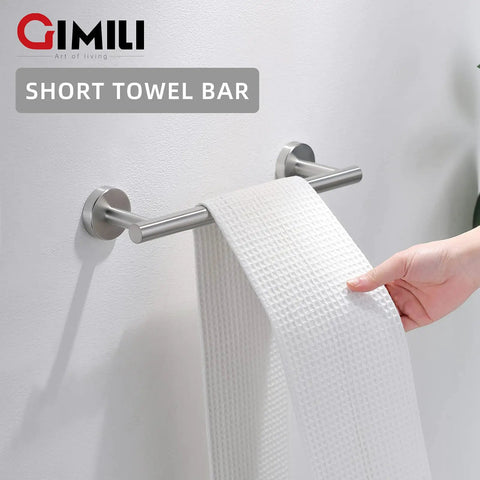 Hand placing towel on Sleek Dope Brushed Nickel 8-Piece Bathroom Hardware Set wall-mounted short stainless steel towel bar