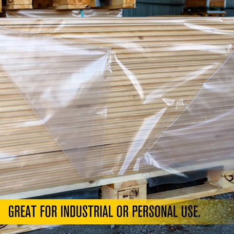 Clear All Purpose Poly Sheeting Roll Heavy Duty 4 Mil Extra Strong Tear Resistant Plastic Sheeting 20 Feet By 100 Feet For Construction Painting Tarping And Pro Grade Jobsite Protection covering wooden boards on a pallet.