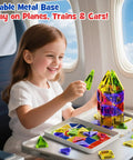 Child playing with On The Go Magnetic Tiles For Kids 40Pcs STEM Building Blocks on airplane tray table.