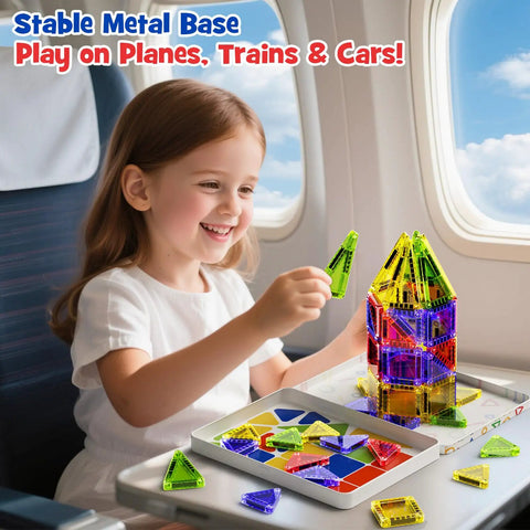 Child playing with On The Go Magnetic Tiles For Kids 40Pcs STEM Building Blocks on airplane tray table.