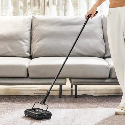 No Strings Attached Manual Carpet Sweeper For Hardwood Floors Tile And Area Rugs Zero Cords Or Batteries Needed Just Brisk Sweep Motion in use on area rug.
