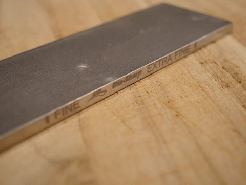 Two Sided Diamond Sharpening Stone, 6 Inch Bench Stone With Fine And Extra Fine Grits for Knives, Chisels, and Planes on wood surface