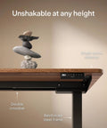 Built Tough Electric Standing Desk With Heavy Duty Dual Motors And Super Smooth Height Adjustments, showing sturdy walnut top and steel frame.