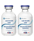 Two glass vials with blue caps labeled Lab Grade H2O Reconstitution Solution, 30 mL each, USA-made.