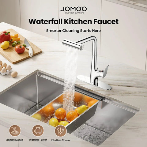 JOMOO Waterfall Pull Down Kitchen Faucet in chrome pouring water over fruits in a stainless steel sink.