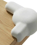 Tot Approved Silicone Corner Protectors For Baby Proofing Tables And Desks Using Heavy Duty Peel And Stick System To Cushion Hard Hits And Shield Rowdy Kids From Sharp Edges In Crisp White 12 on wooden table edge.