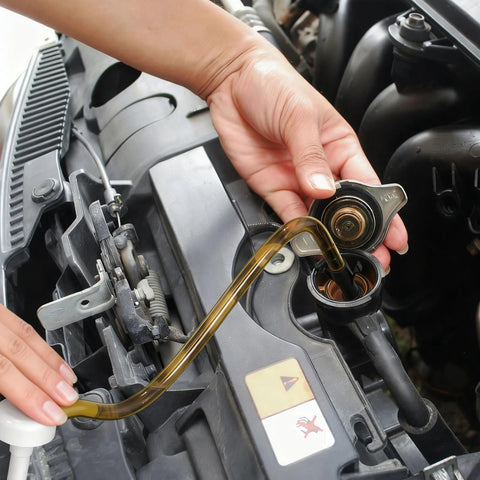 Two-pack Amazon fluid transfer pumps with amber tubing; hand installing into engine bay reservoir