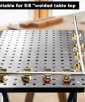 Magnetic V Block Fixture Pin for welding tables with adjustable pipe holder clamp securing round tubes on a perforated table.