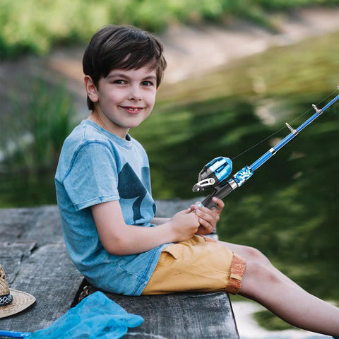 Child sitting by a lake using Portable Telescopic Kids Fishing Pole Set for Boys and Girls 2 Pack with Rod and Reel Includes Tackle Box