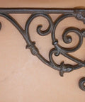 Kick Up Your Space With These Heavy Duty Victorian Corner Shelf Brackets Solid Cast Iron Rustic Brown Finish Built Tough For Windows Vintage Look Set Of Four, close-up view of intricately designed bracket.