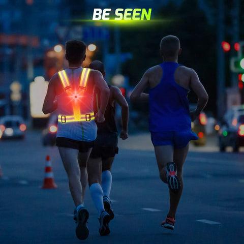 Runners wearing Lit Up Running Vest With 360 Visibility, Reflective Chest And Red Back LED Lights, visible at night