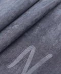Close-up image of 54x20 inch grey faux leather Self-Adhesive Leather Repair Patch For Couch Sofa Car Seat Chair And Vinyl Furniture.