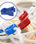 Three Pack Peritoneal Flow Control Clips For Dialysis Tubing And Bag Clamp On The Go Portable ABS Clips Replacement Peritoneal Dialysis Accessories Blue shown with tubing