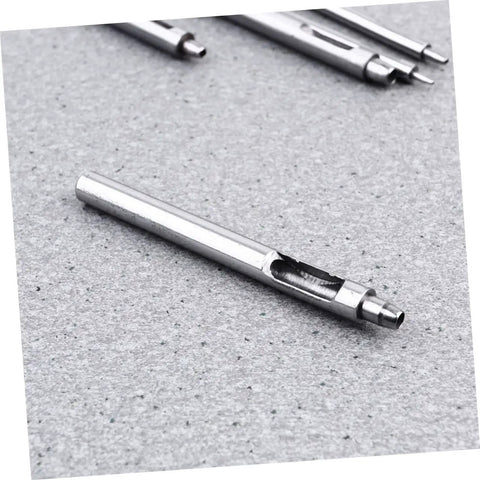 Heavy Duty Leather Belt Hole Punch Tool Set for DIY Projects and Falconry Crafts, hole puncher detail on gray surface