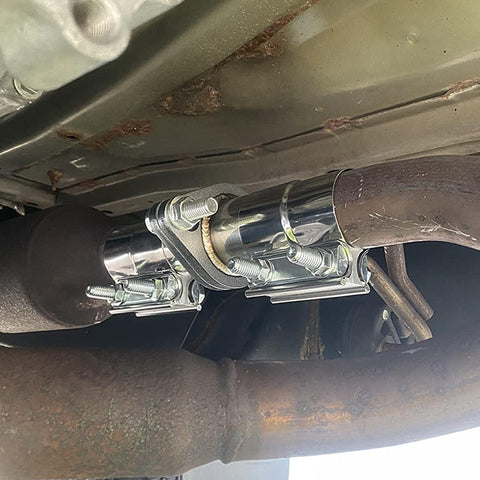 Exhaust Flange Repair Piping Kit 2.5 Inch ID To 2.5 Inch OD With Gasket And Bolt installed on vehicle exhaust system.