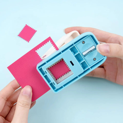 Lever Action Postage Stamp Punch 1x0.8 Inch Rectangular Stamp Shaped Paper Punch in use, cutting pink paper for crafting